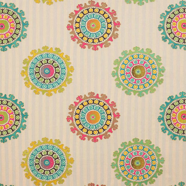 Cream patterned fabric with bright circular medallions in turquoise, pink, lime and yellow