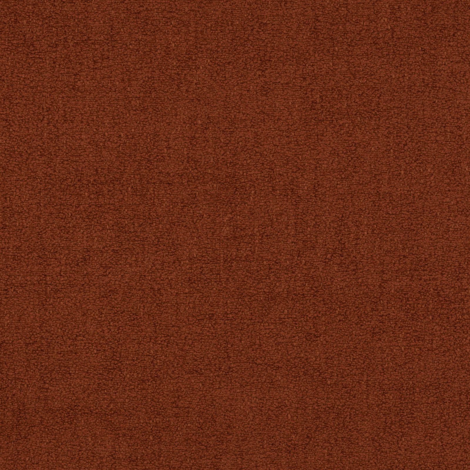 Close-up of a deep terracotta textured plain fabric with fine speckled weave