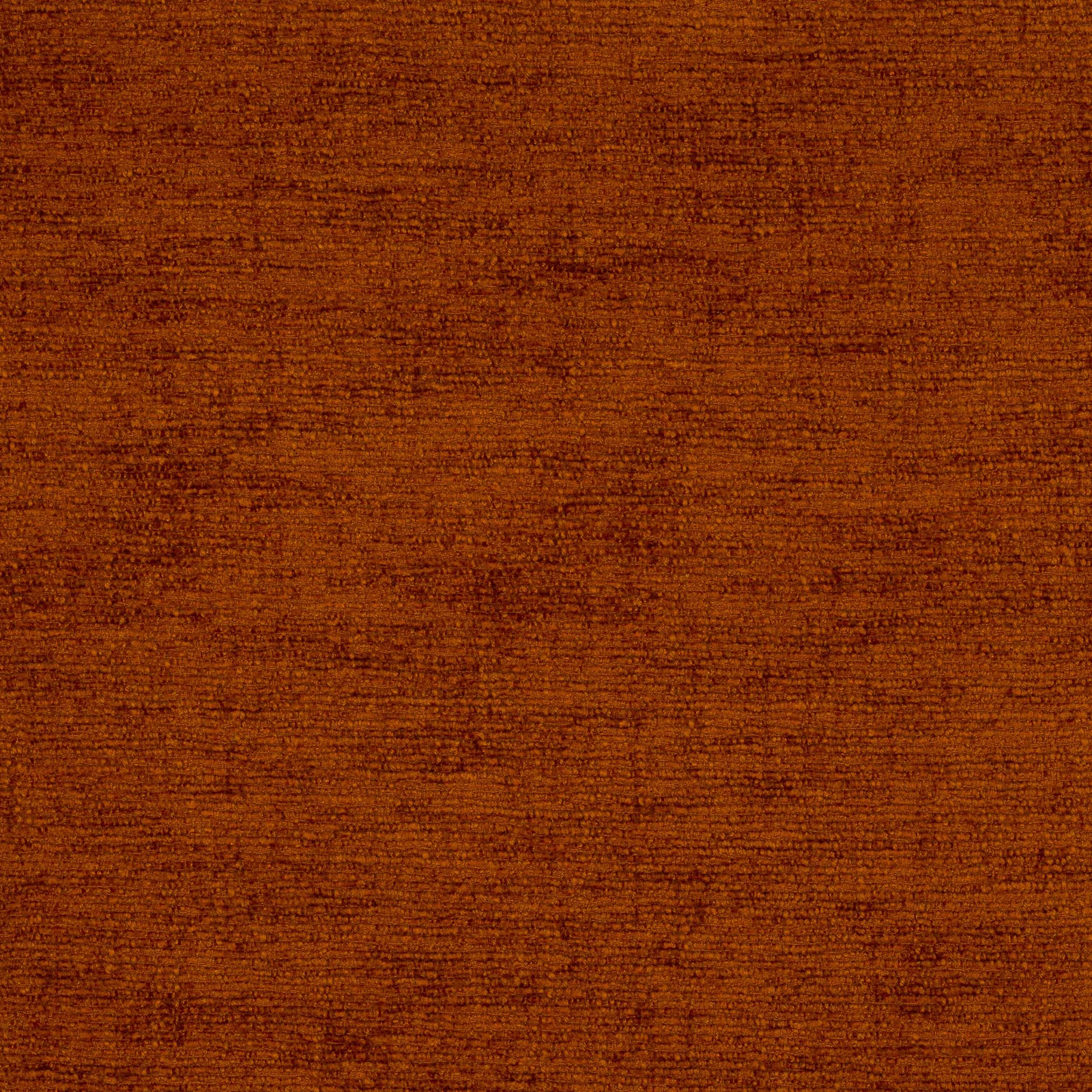 Close-up of burnt spice orange woven fabric with fine mottled texture