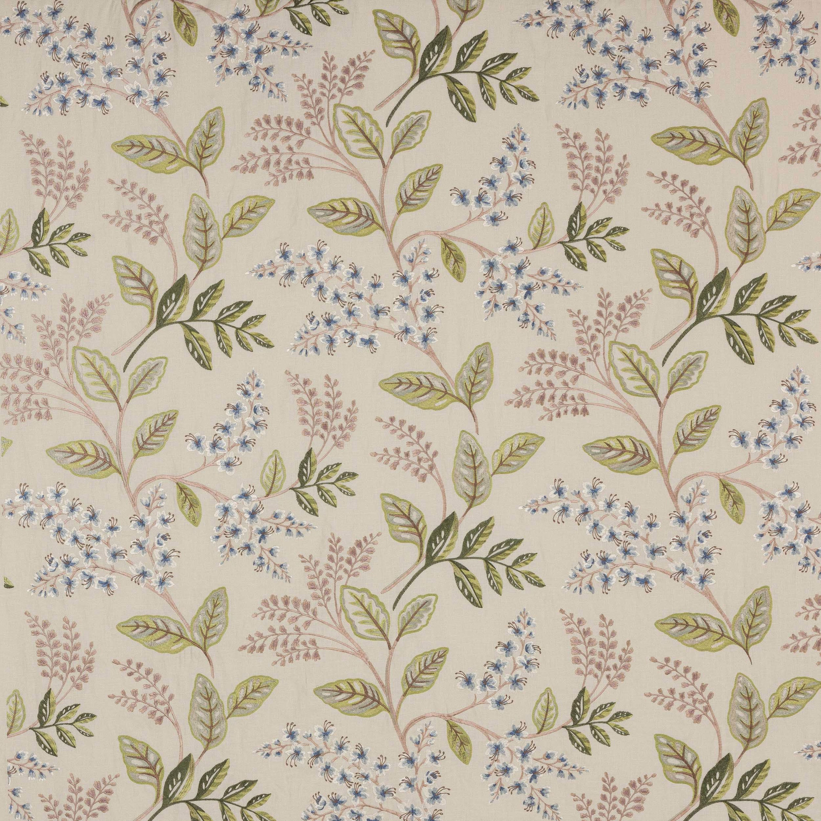 Cream botanical fabric with blue flower sprigs and sage-green leaves