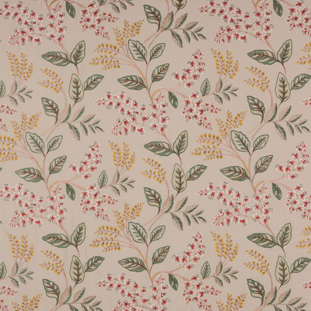 Botanical floral fabric with soft red blossoms, sage leaves and yellow sprigs on a pale ground