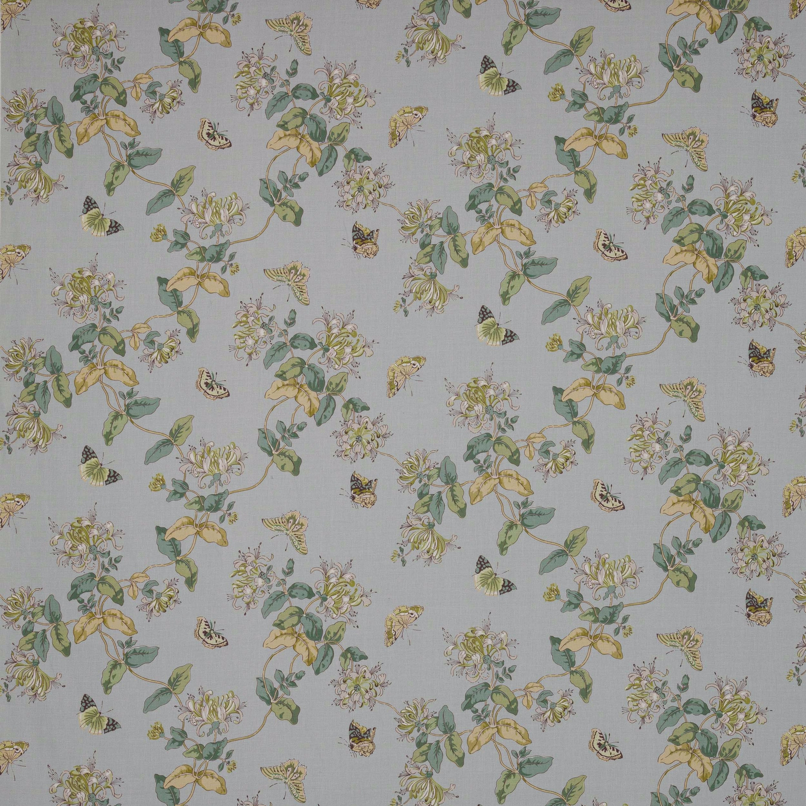 Powder blue linen fabric with trailing florals and butterflies in soft green and yellow