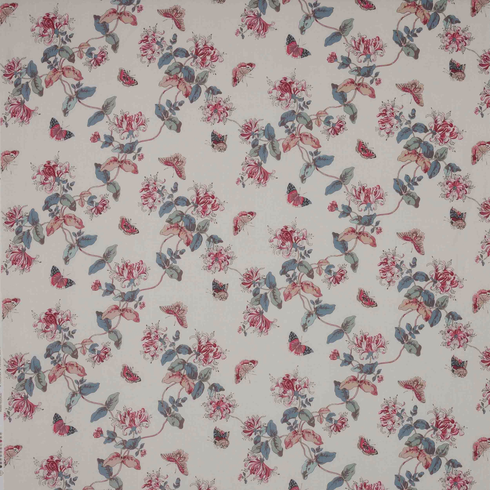 Cream linen fabric with scattered pink flowers, slate leaves and small butterflies
