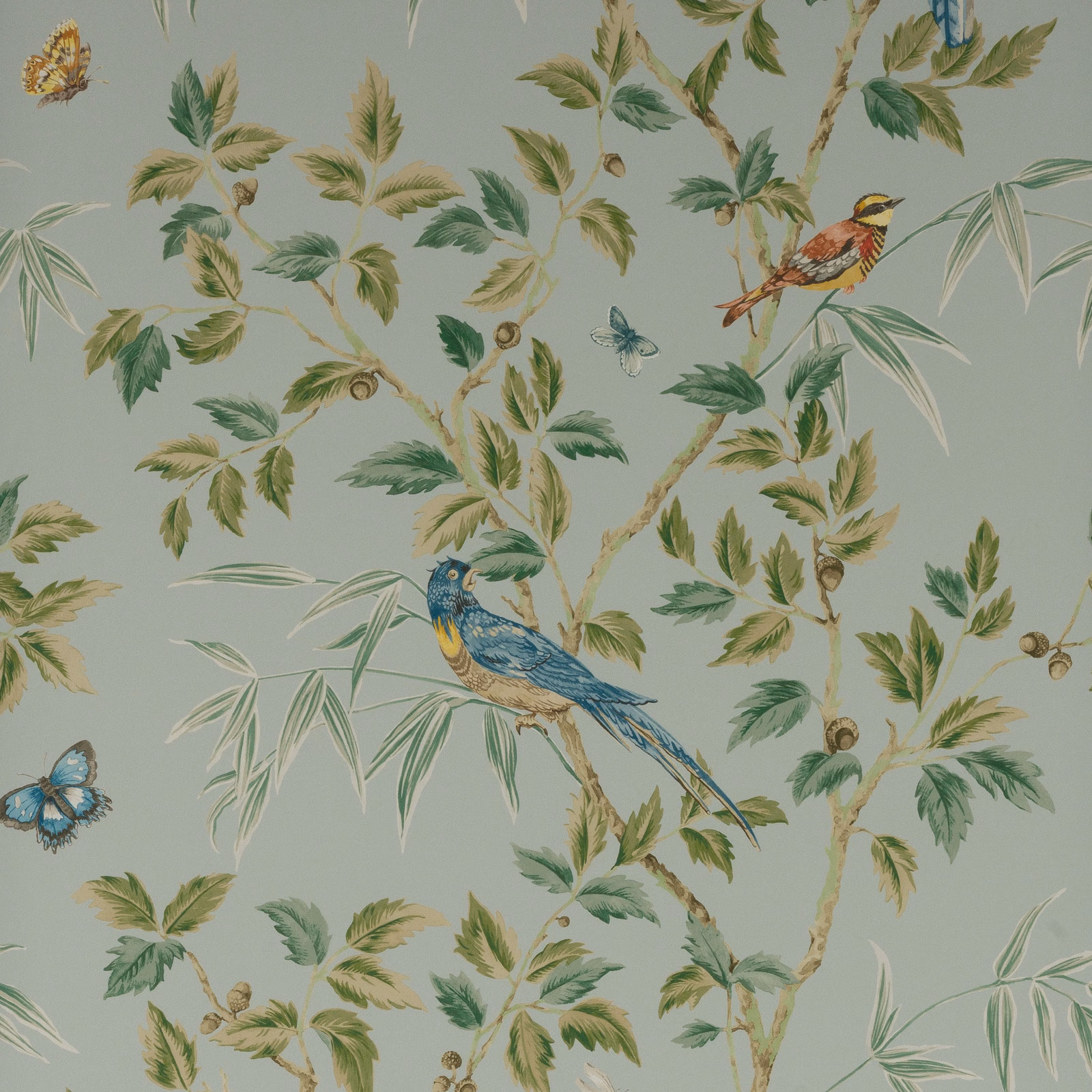 Muted Old Blue wallpaper with painted birds, leafy branches and bamboo-like foliage