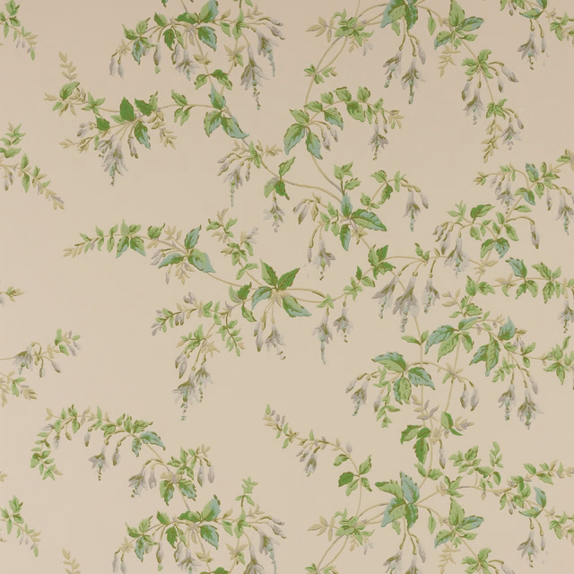 Pale taupe wallpaper with muted green leafy sprays and delicate grey trailing flowers