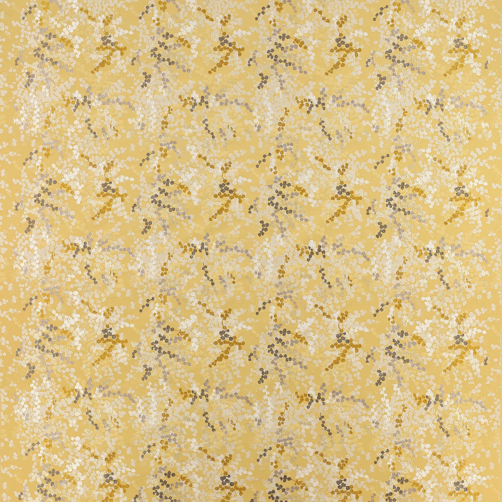 Golden yellow fabric with a fine dotted abstract pattern in cream and brown