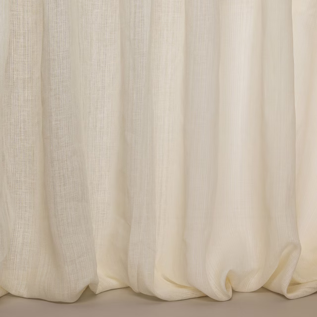 Soft ivory linen-blend fabric with gentle vertical slub and flowing folds