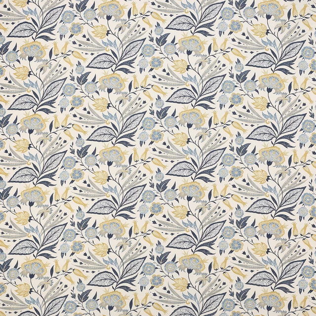 Floral vine fabric in indigo, pale blue and soft yellow on an ivory ground