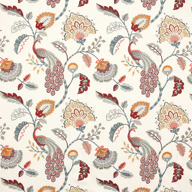 Patterned fabric swatch with peacocks, floral motifs and slate red detailing on cream