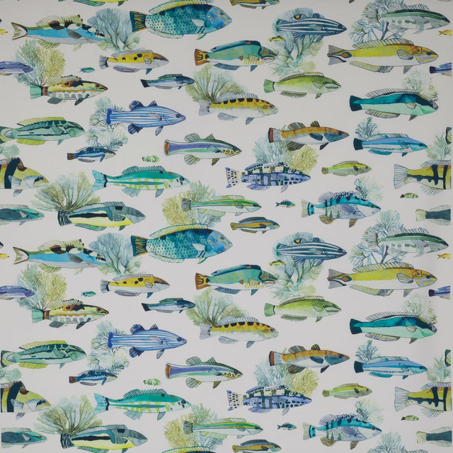 Printed fabric swatch with aqua and blue fish on a pale ground