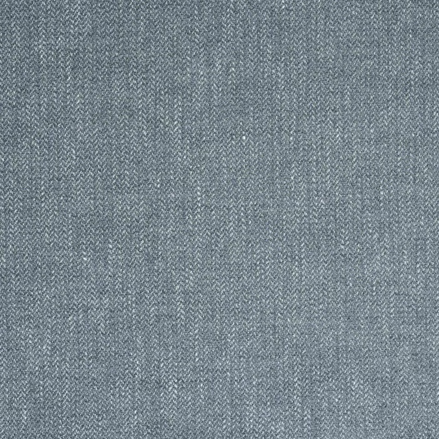 Close-up of muted slate blue woven fabric with a fine textured surface