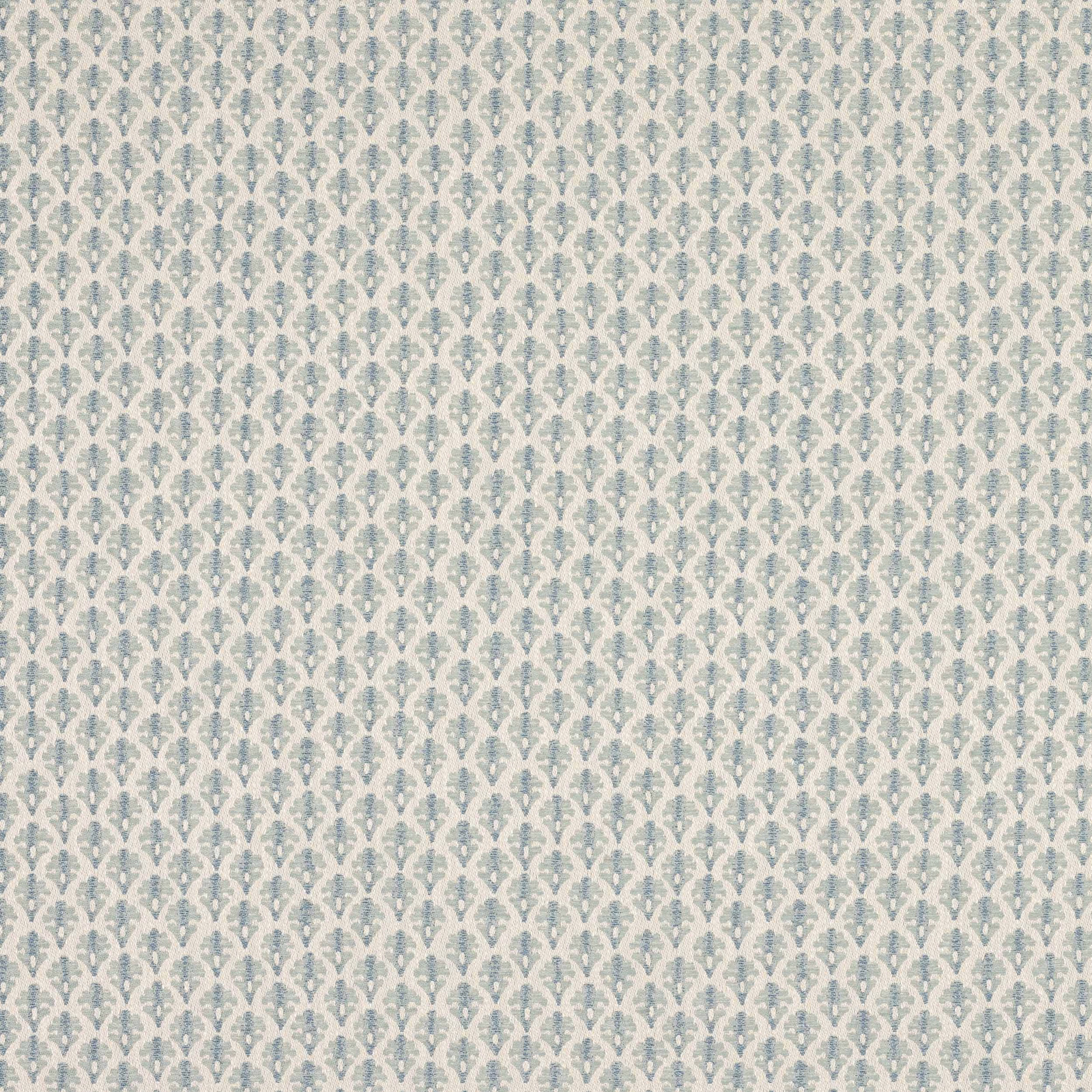 Small repeating old blue and cream damask pattern on woven fabric