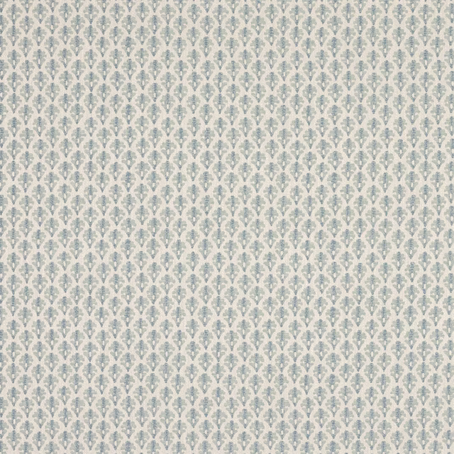 Small repeating old blue and cream damask pattern on woven fabric