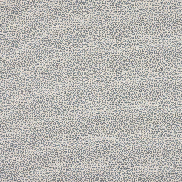 Close-up of small blue-grey animal spots on a pale textured woven fabric