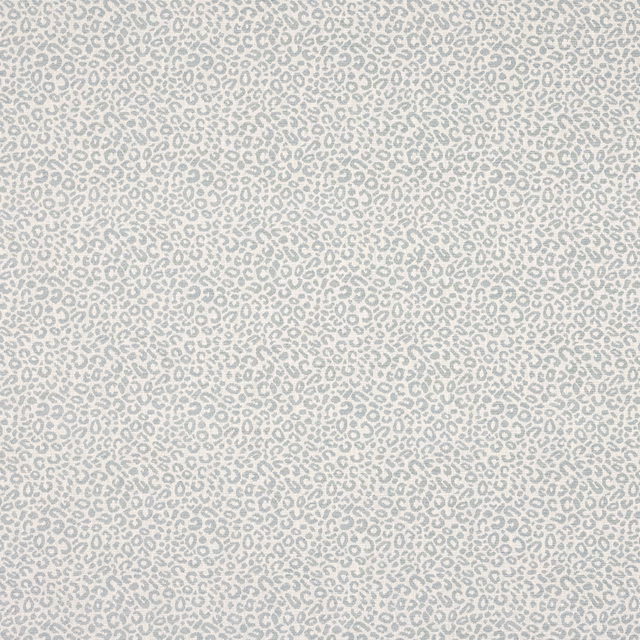 Pale blue animal spot fabric on a light ground with fine small-scale repeat