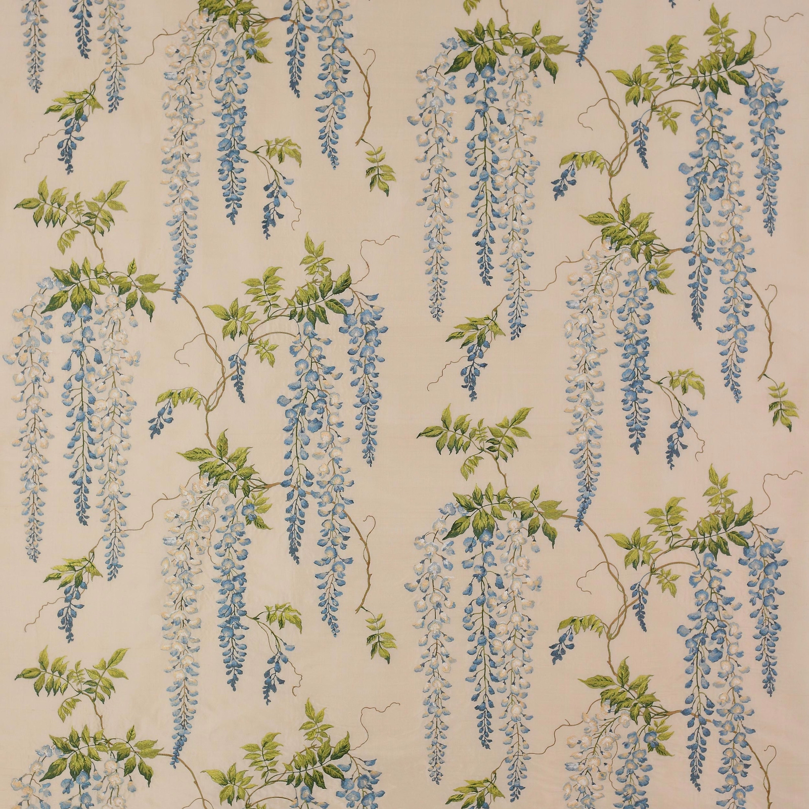 Blue and green wisteria trail on an ivory silk-blend fabric swatch