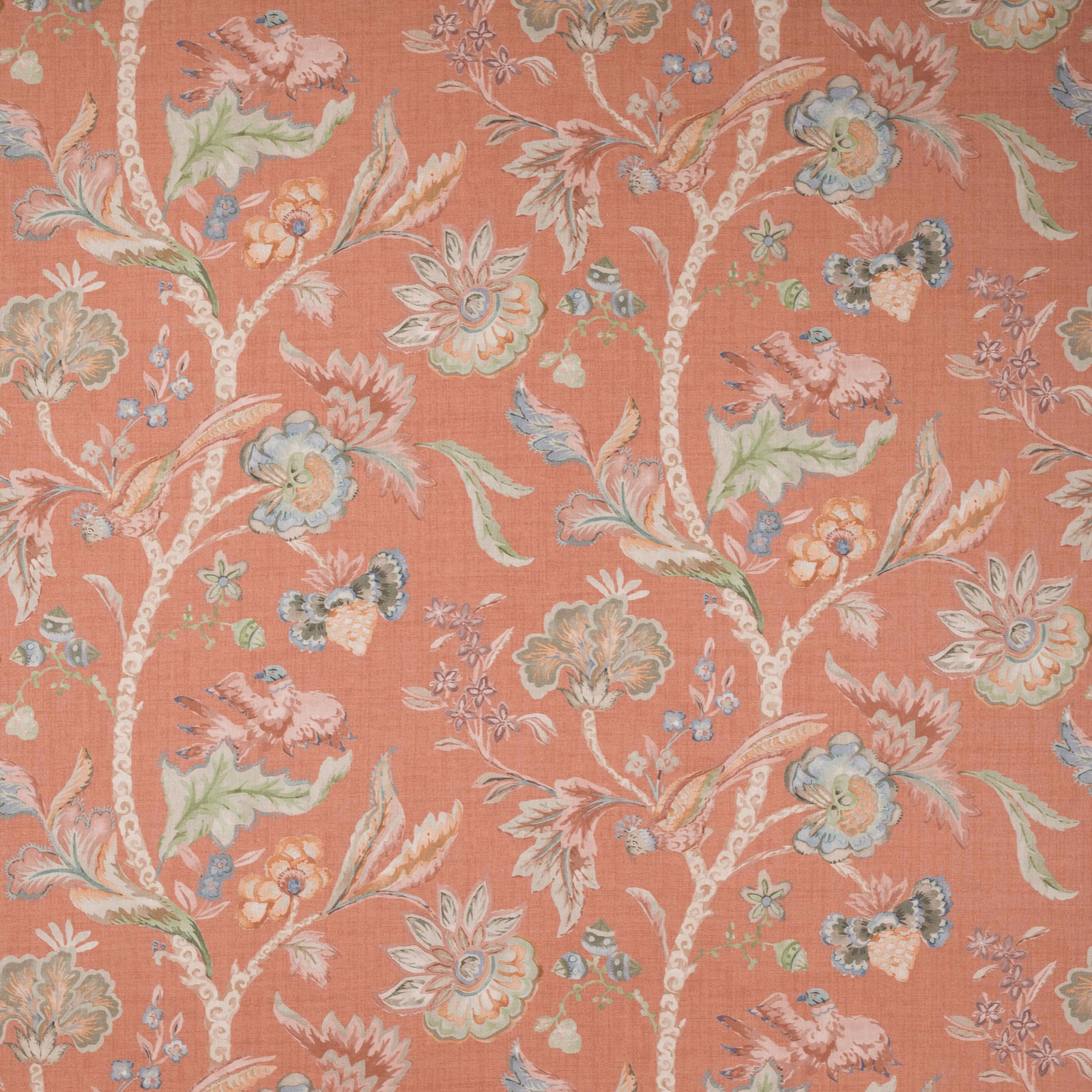 Coral-red linen fabric with large painterly floral branches and soft pastel highlights