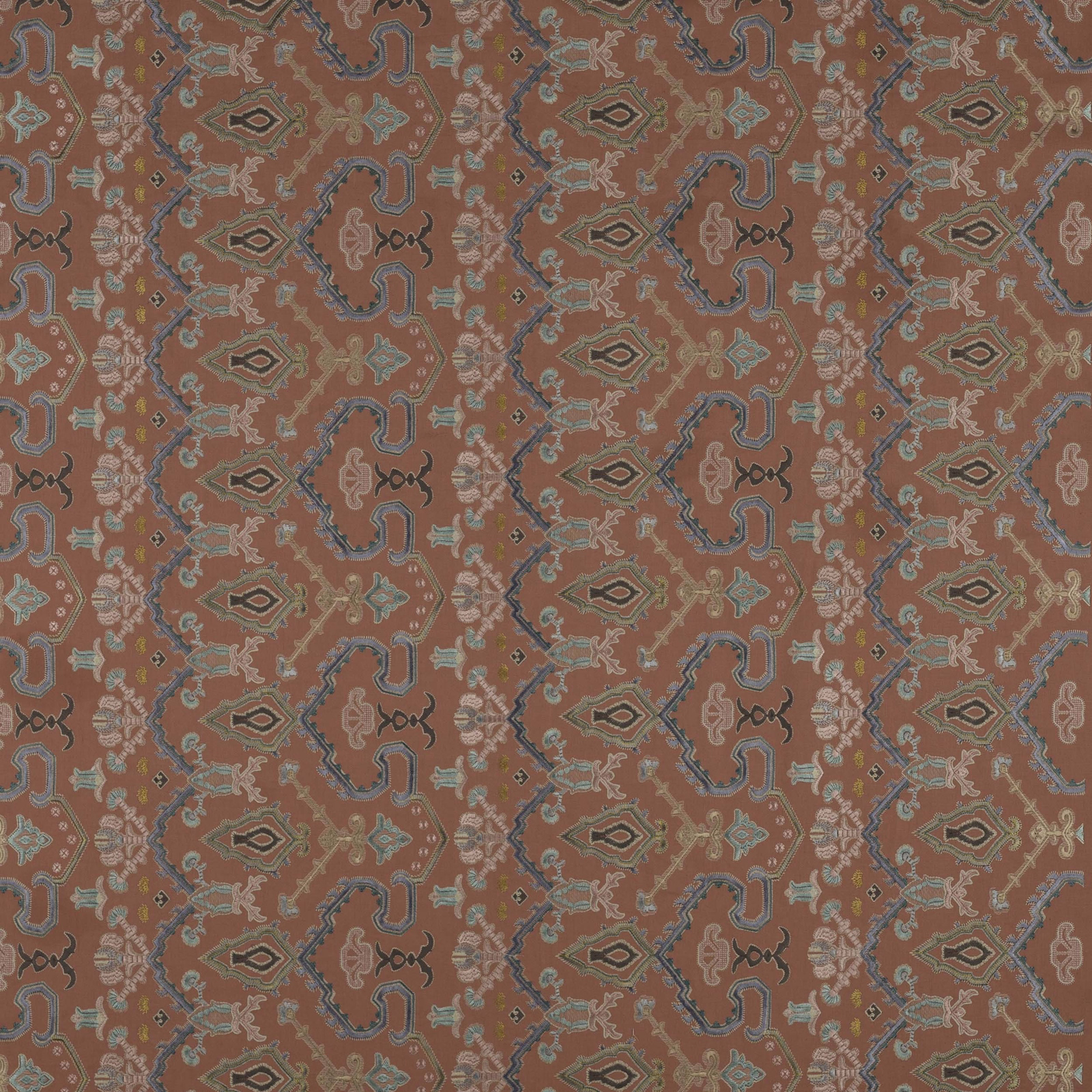 Coral red patterned fabric with teal and taupe geometric motifs