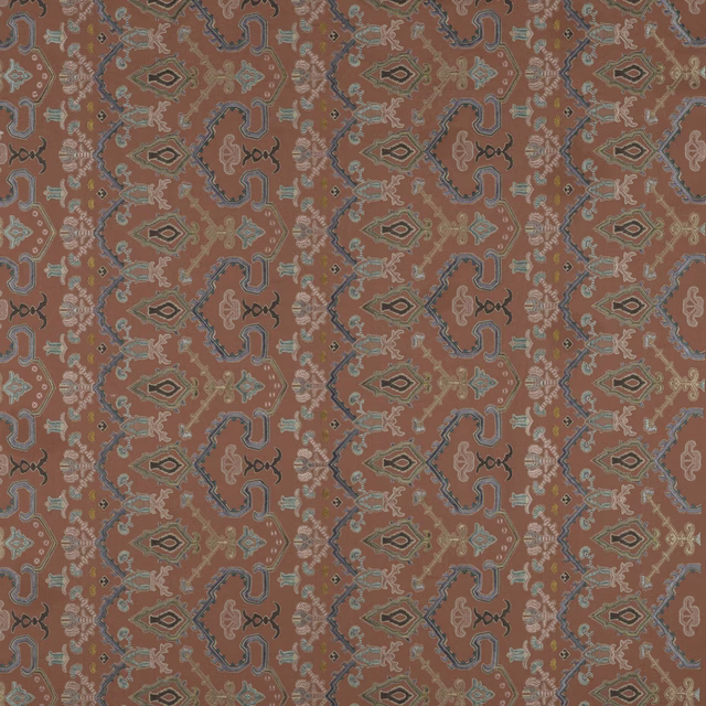 Coral red patterned fabric with teal and taupe geometric motifs