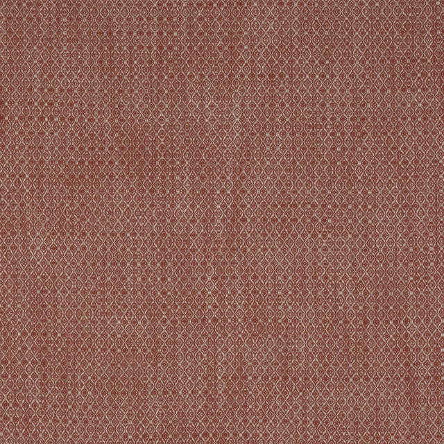 Warm tomato-red woven fabric with tiny geometric diamond repeat