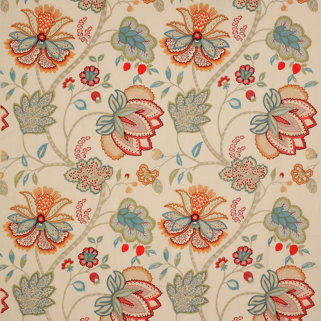 Large embroidered floral fabric on warm cream ground with red and sage blooms