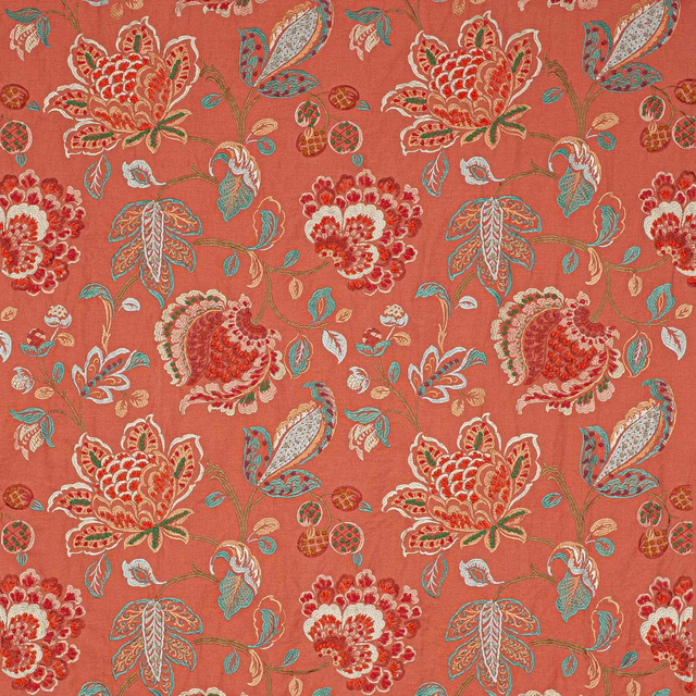 Coral-red floral fabric with large embroidered-look blossoms and trailing leaves