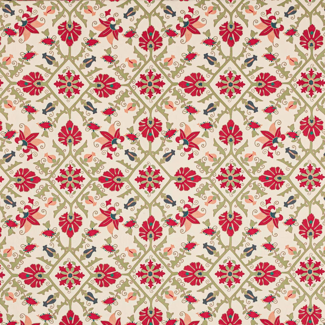 Red floral lattice fabric with sage green scrolling vines on a pale ground