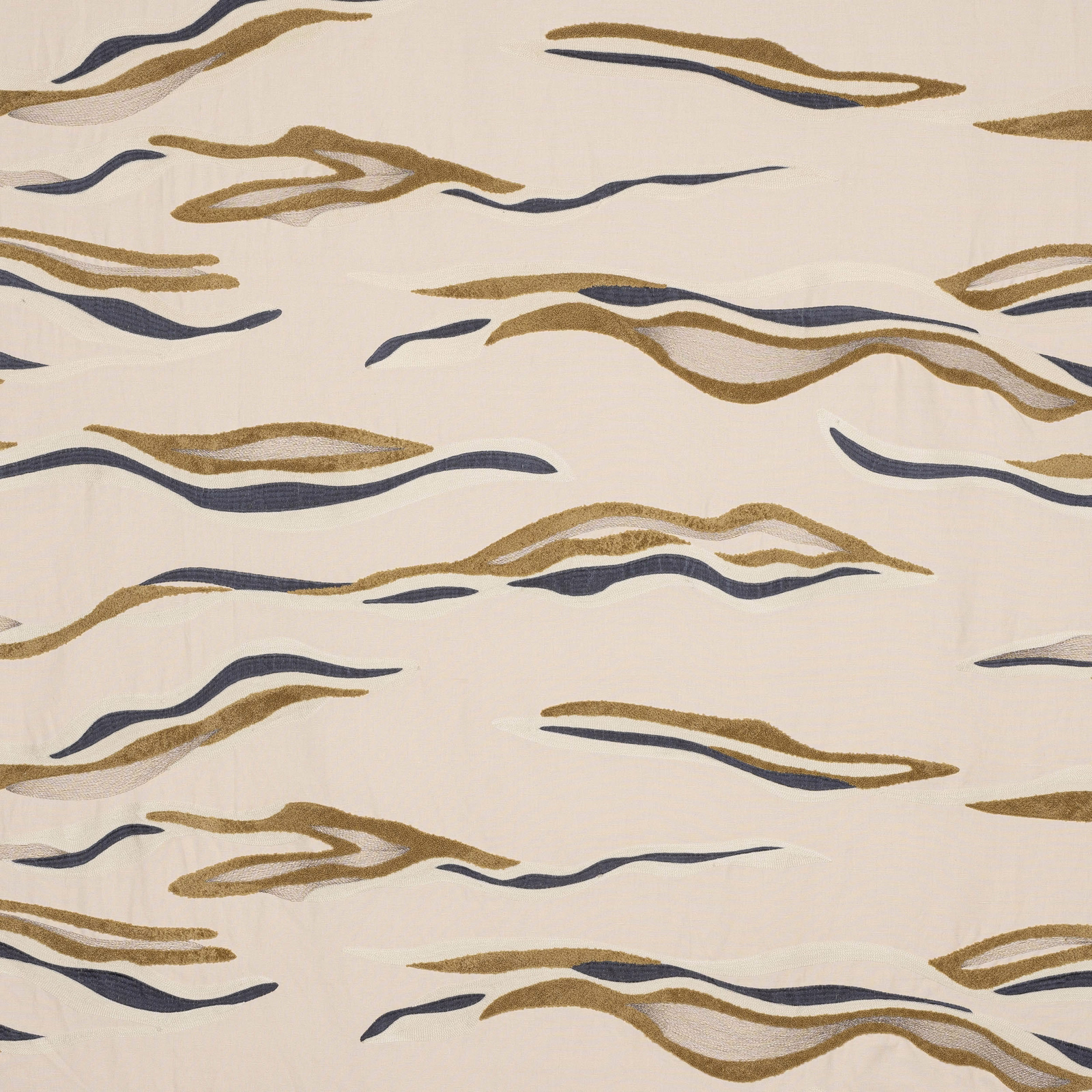 Cream fabric swatch with sweeping gold and navy abstract ribbon stripes