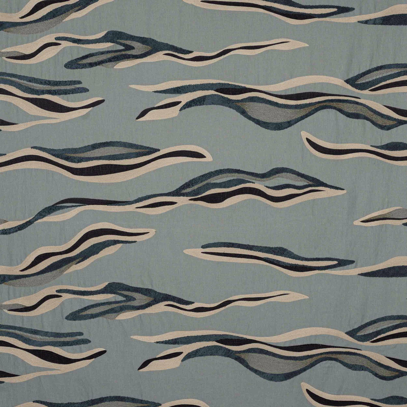 Abstract wave-pattern fabric on a pale sea-blue ground with navy and cream streaks