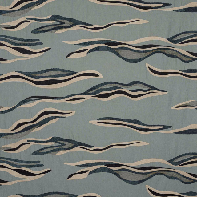 Abstract wave-pattern fabric on a pale sea-blue ground with navy and cream streaks