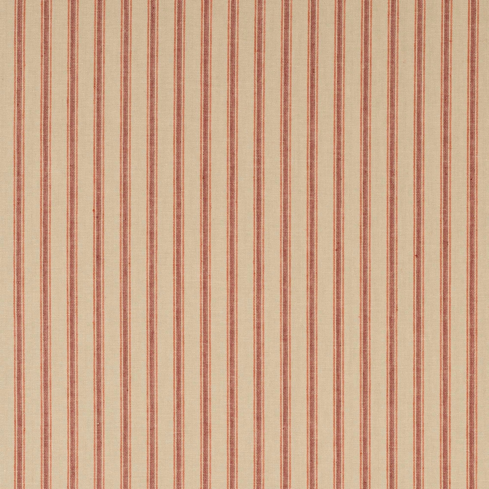Close-up of soft red and blush vertical stripes on natural linen fabric