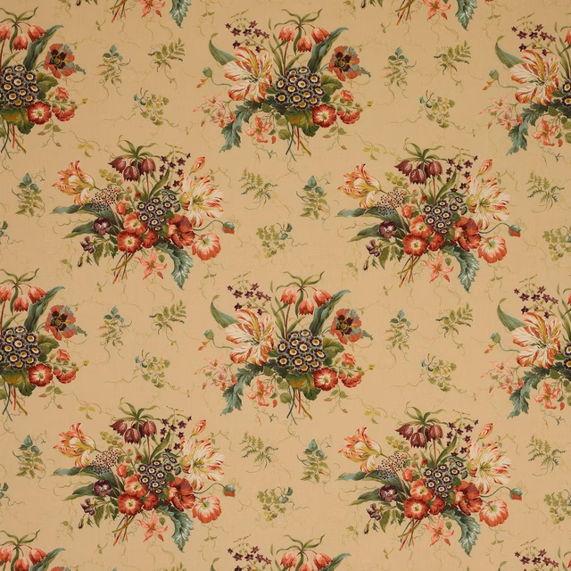 Floral print fabric on warm pink-sand ground with spaced bouquets in coral, berry and green