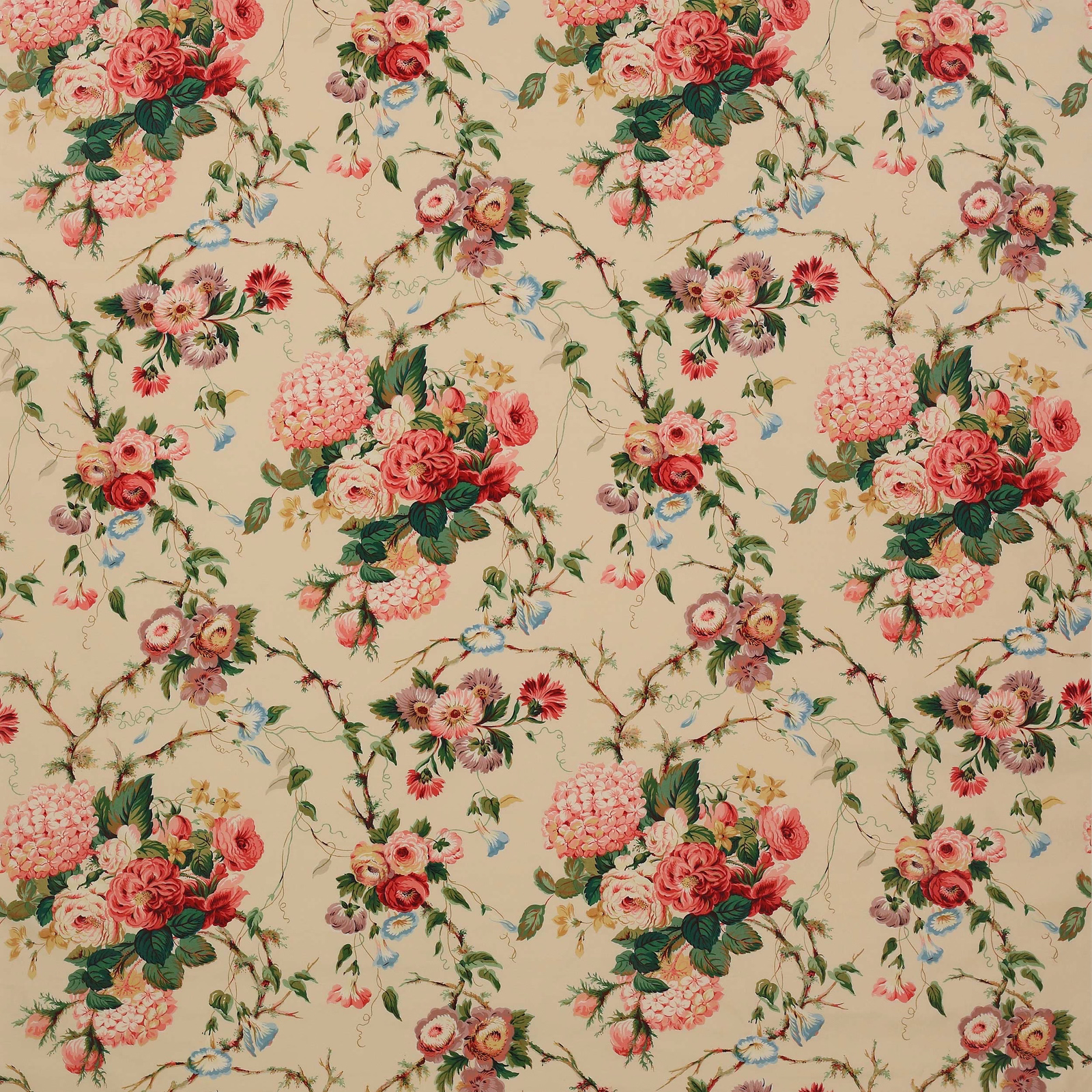 Large pink floral bouquets and green foliage on a warm cream cotton ground