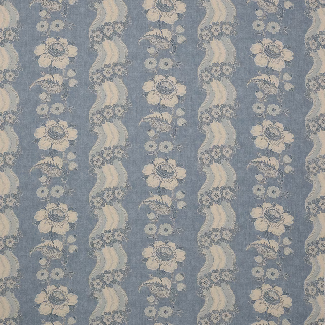 Blue linen fabric with cream floral stripes and a soft woven texture