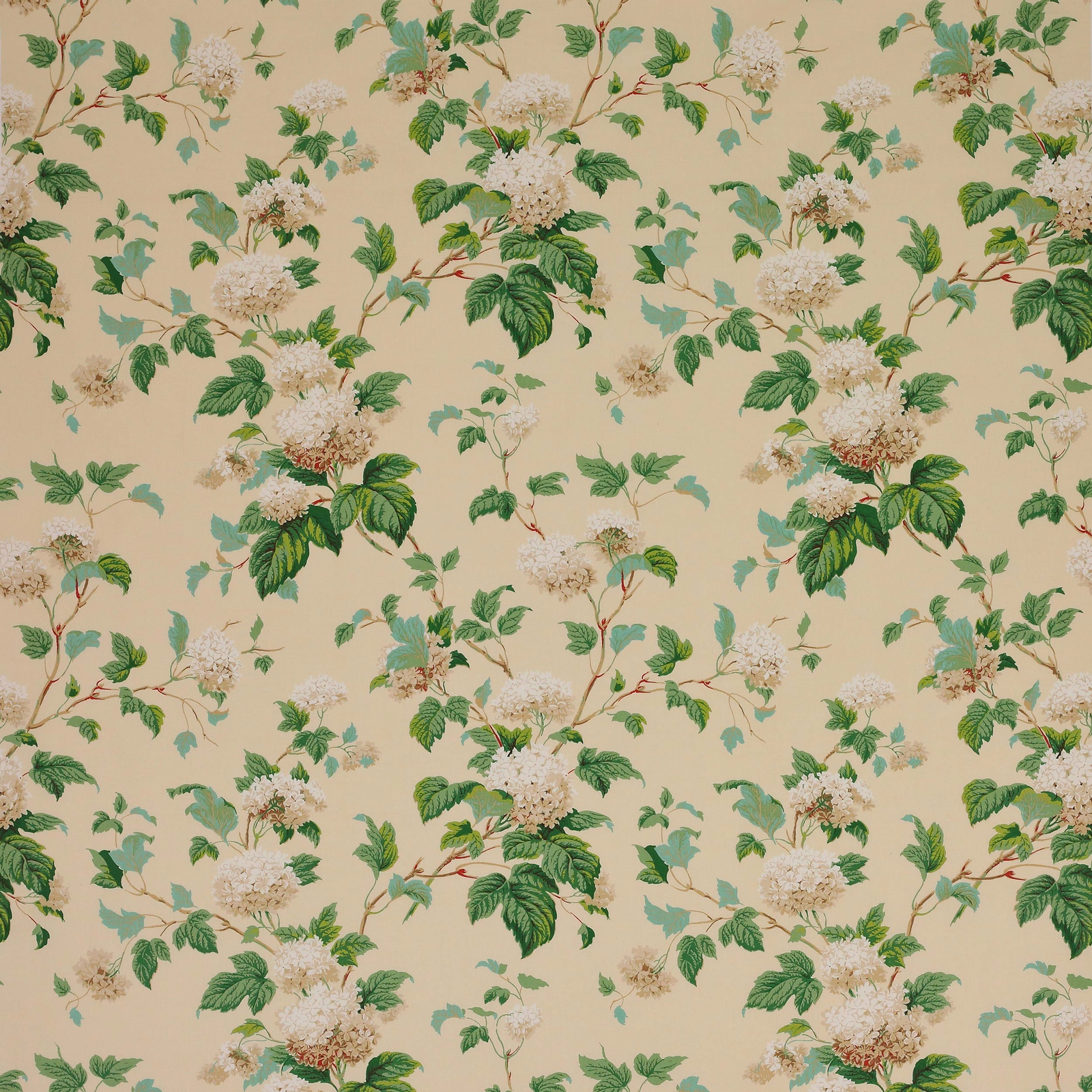 Cream floral cotton fabric with green leaves and pale blossom clusters