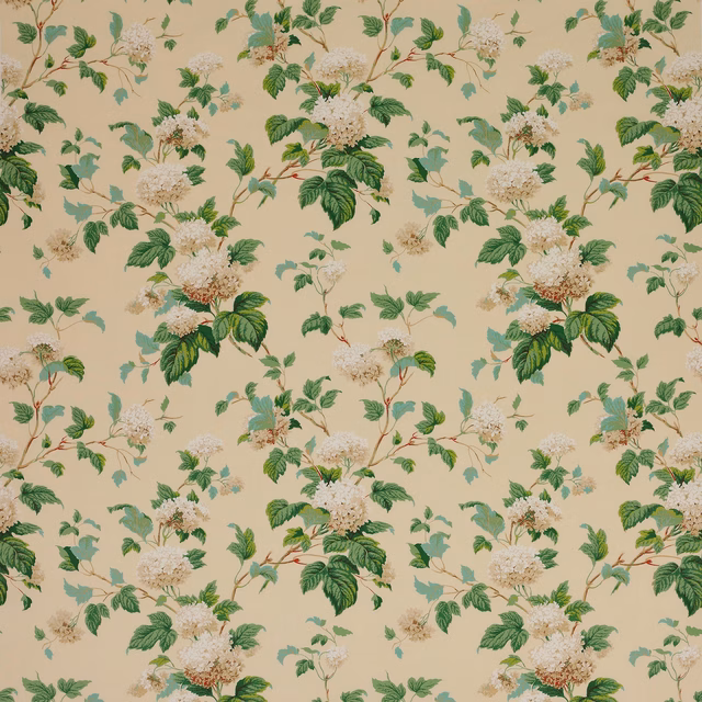 Cream floral cotton fabric with green leaves and pale blossom clusters