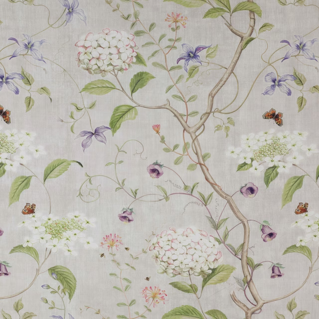 Beige linen floral fabric with lilac blossoms, green leaves and trailing branches