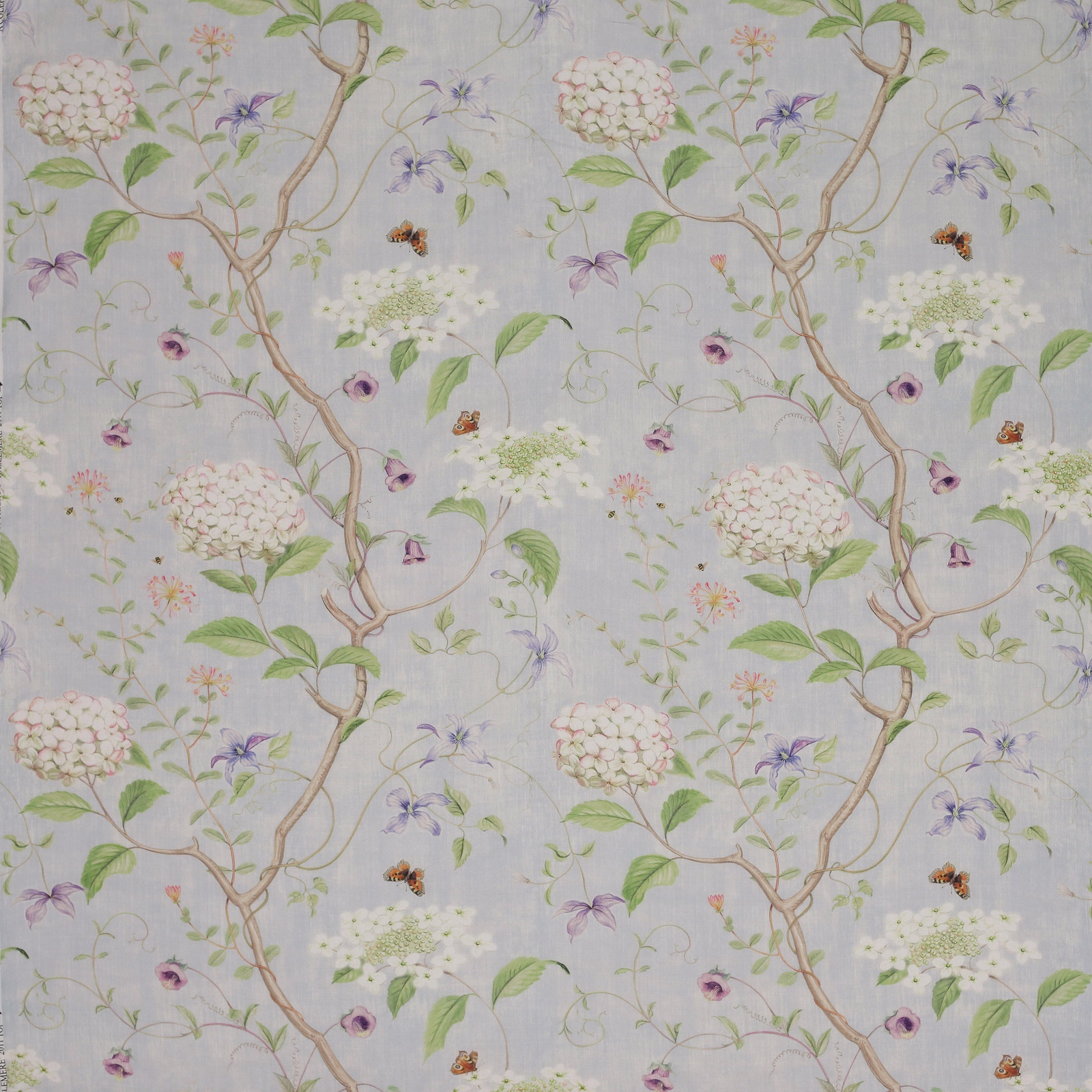 Pale blue linen fabric with trailing floral branches, butterflies and soft botanicals
