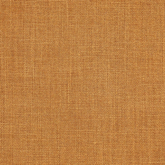 Close-up of warm saffron linen with fine plain weave texture