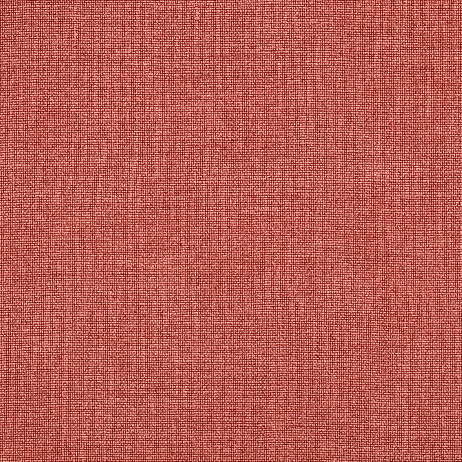 Close-up of warm tomato-red plain woven linen fabric with fine texture