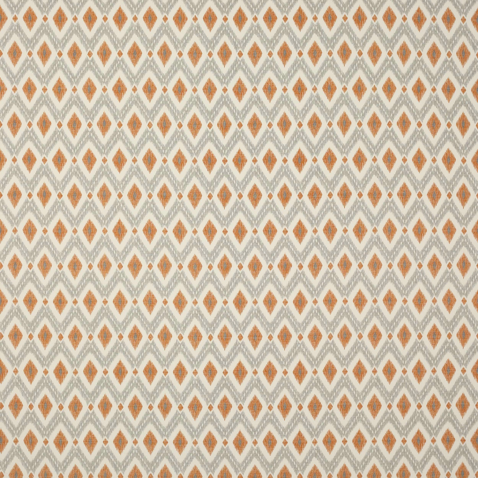 Small orange diamond pattern on a pale cream woven cotton fabric