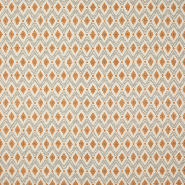 Small orange diamond pattern on a pale cream woven cotton fabric