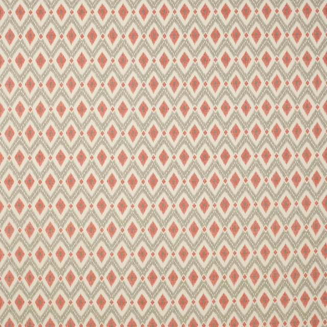 Coral-red diamond geometric fabric on an oatmeal ground with zigzag rows