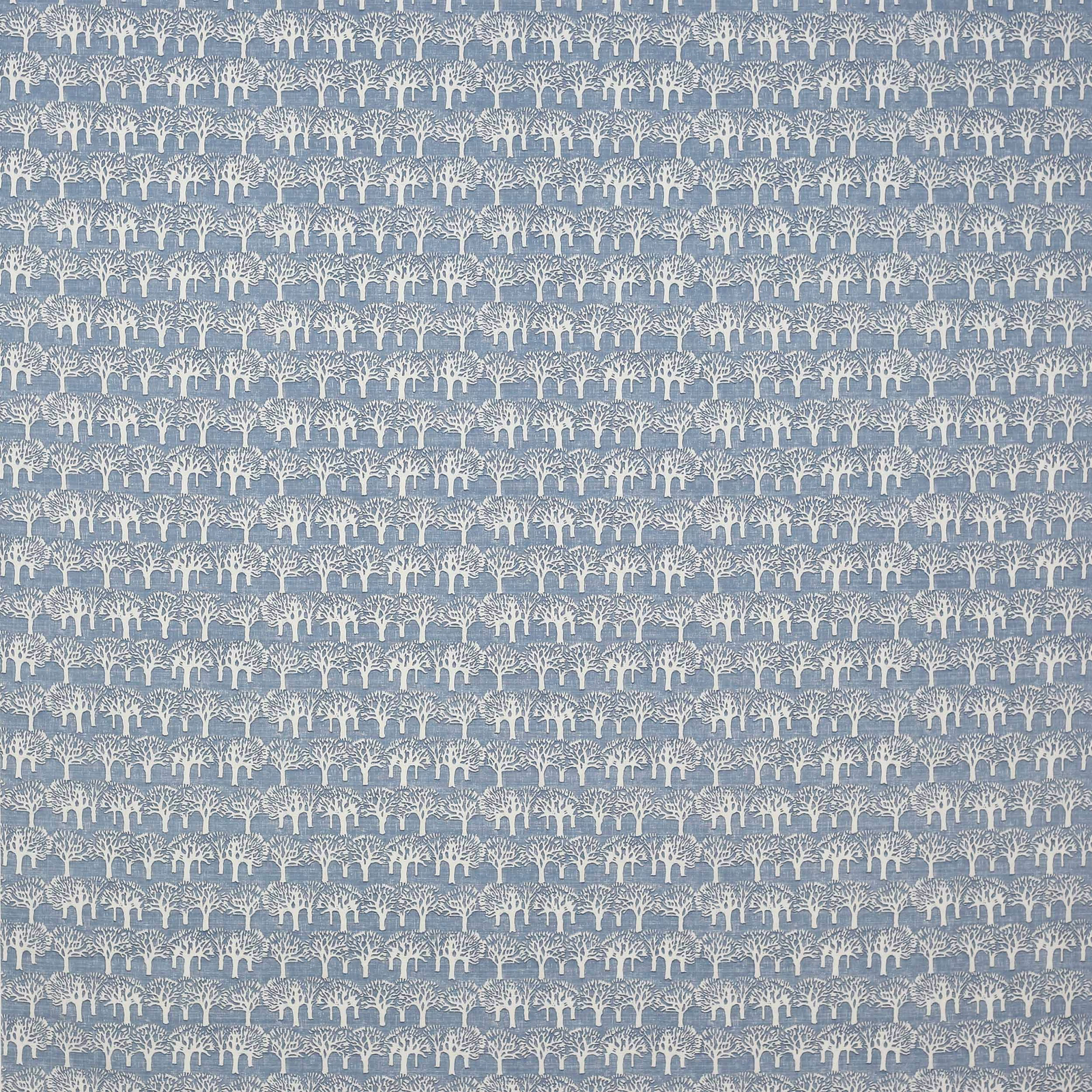 Blue cotton fabric swatch with small cream tree motif on a muted ground