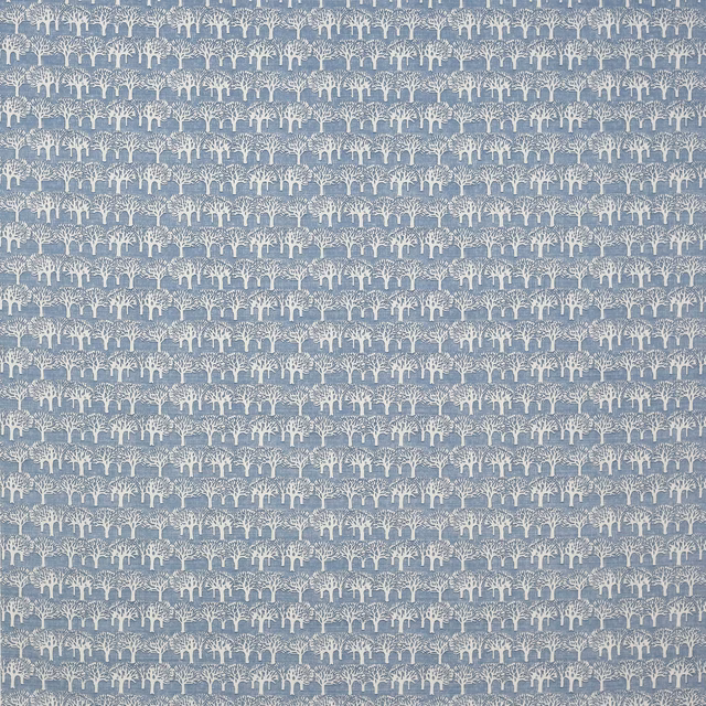 Blue cotton fabric swatch with small cream tree motif on a muted ground