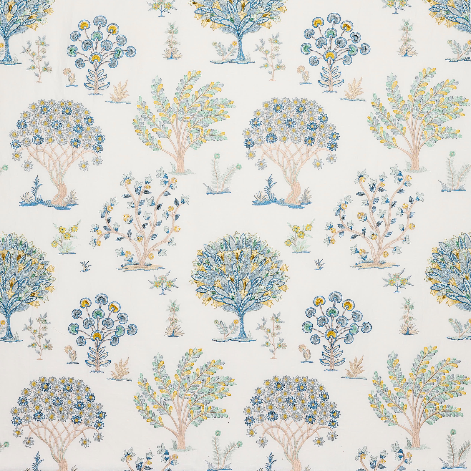Off-white printed fabric with scattered stylised blue and yellow tree motifs