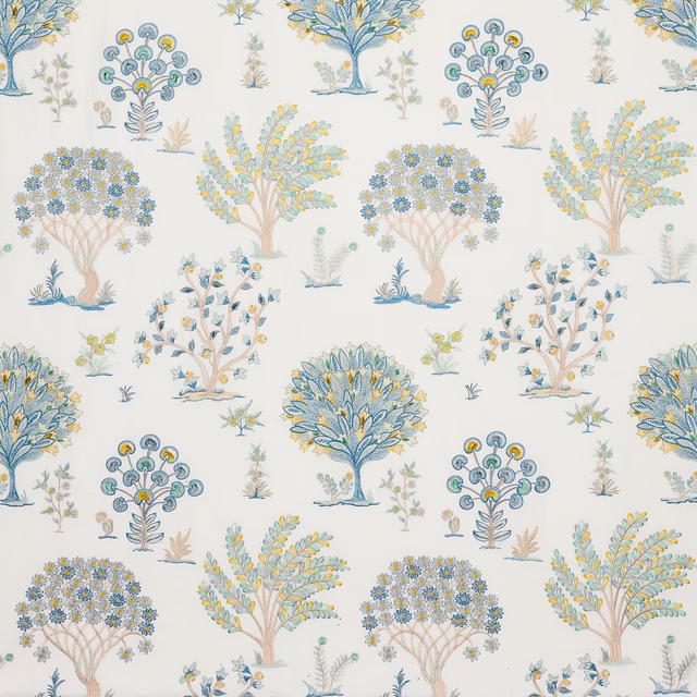 Off-white printed fabric with scattered stylised blue and yellow tree motifs
