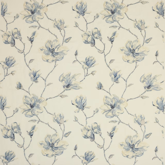 Pale cream fabric with large sketchy blue floral branches and soft ivory-blue blossoms