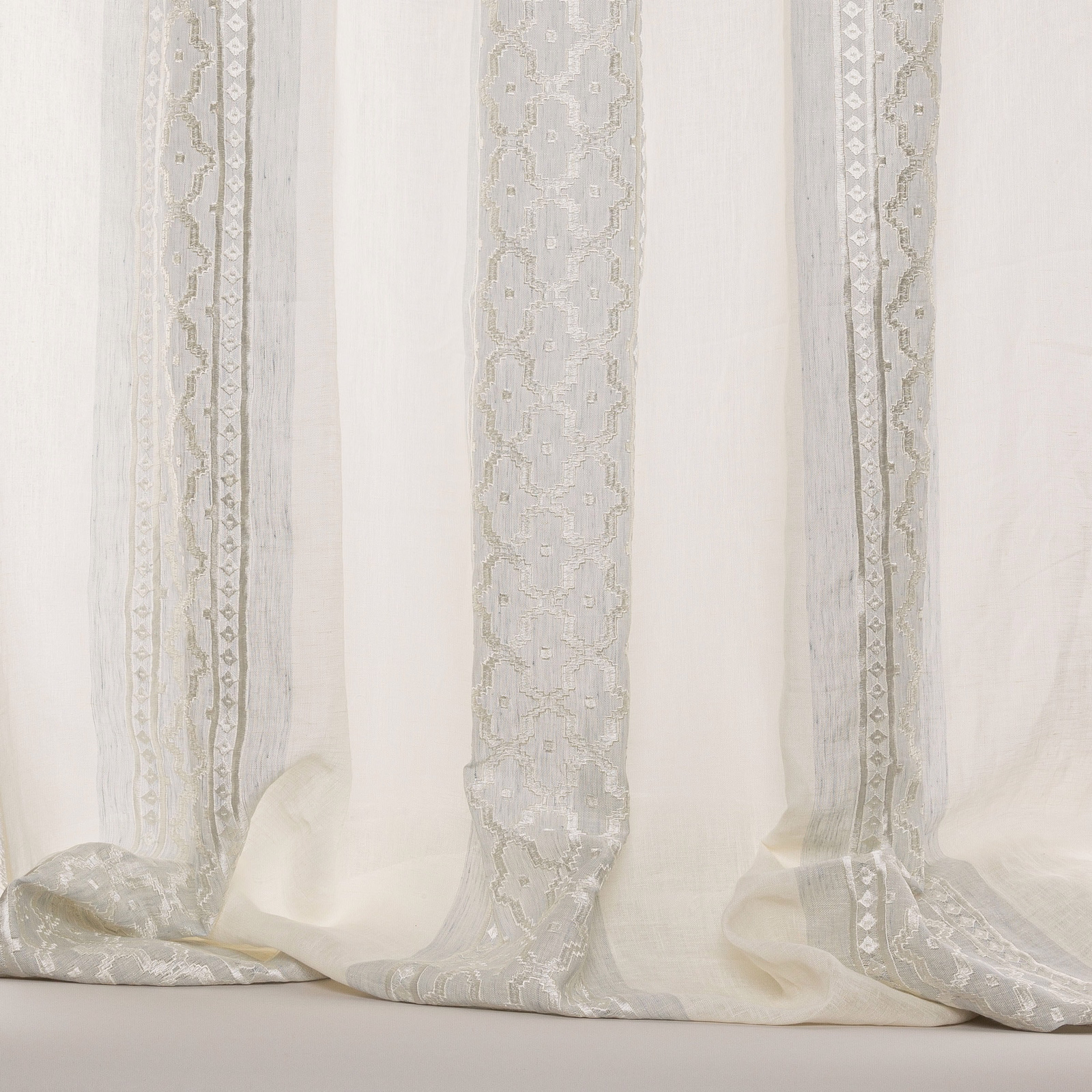 Sheer striped fabric in soft old blue with pale woven decorative bands
