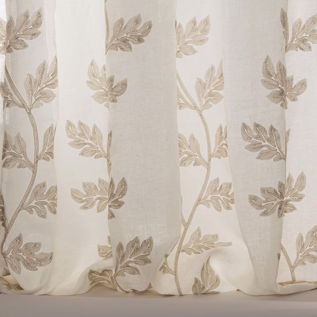 Ivory sheer fabric with taupe embroidered leaf branches and soft linen texture